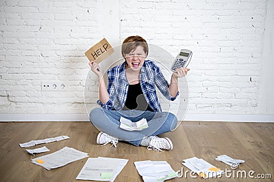 Crazy stressed woman with calculator and bank and bills paperwork and documents doing domestic financial accounting Stock Photo