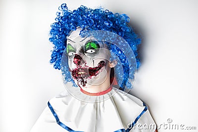 Crazy ugly grunge evil clown. Scary professional Halloween masks. Halloween party Stock Photo