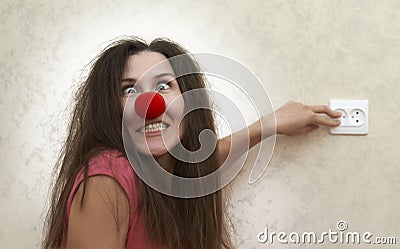 Crazy woman thinks she is a light bulb Stock Photo