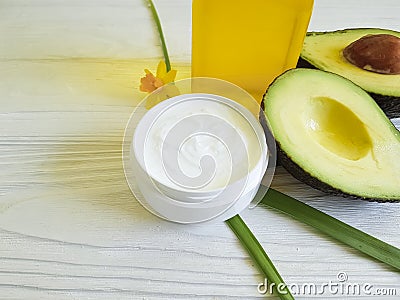 cream, avocado mask oil organic handmade on a wooden background, flower Stock Photo