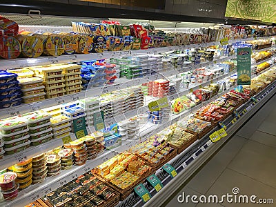 Cream cheese and curd assortment lying in a showcase in a supermarket Editorial Stock Photo