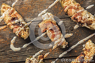 Cream Cheese Filled Bacon Wrapped Jalapeno Poppers On Wood Background Stock Photo