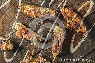 Cream Cheese Filled Bacon Wrapped Jalapeno Poppers On Wood Background Stock Photo