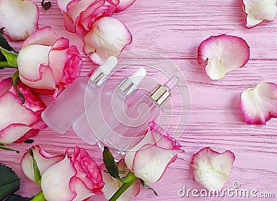 Cream cosmetic rose flower product on wooden background Stock Photo