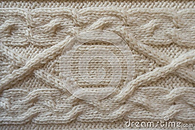 Cream handmade knitwork with horizontal plait pattern Stock Photo