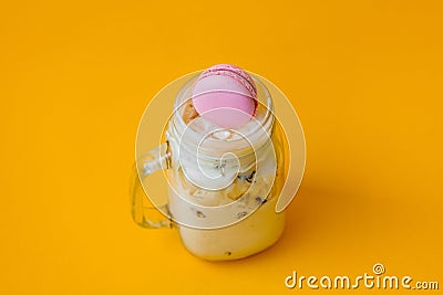 Cream ice-cream with macaron in glass cup Stock Photo