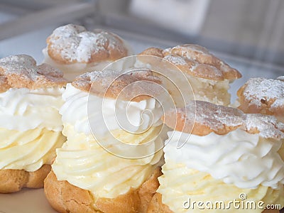 Cream puffs in pastry shop Stock Photo