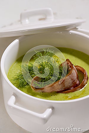 Cream soup with broccoli and grilled bacon flower . Stock Photo