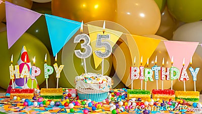 Creamy cupcake with candle for thirty five years, colorful happy birthday card for 35 year old, birthday cupcake with candles Stock Photo