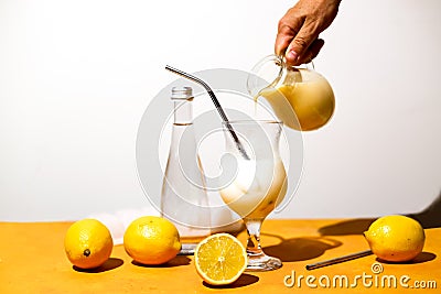 Creamy lemonade trendy summer mocktail. Cold non-alcoholic cocktail with lemon juice and sweetened condensed milk. Stock Photo