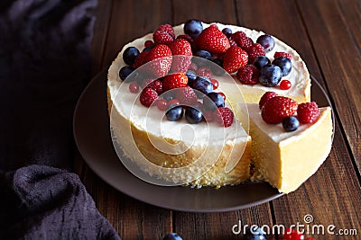 Creamy mascarpone cheese cake with strawberry and winter berries. Christmas New York Cheesecake. Healthy food ration . Stock Photo