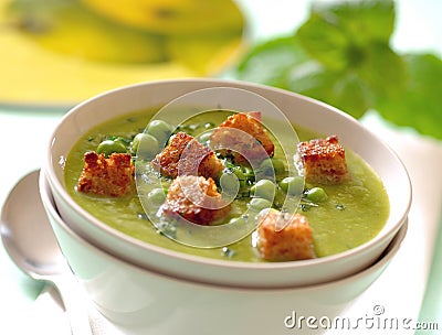 Creamy mint pea soup with croutons. Stock Photo