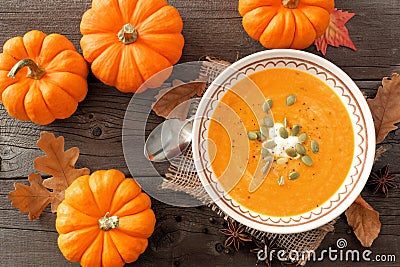 Pumpkin soup, overhead rustic autumn table scene Stock Photo