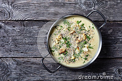 Creamy roasted garlic cauliflower soup in a pot Stock Photo