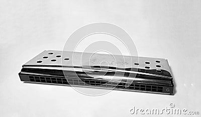 Create a beautiful sound from the 24-hole tremolo harmonica Editorial Stock Photo