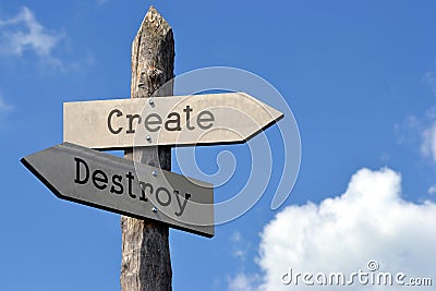 Create and destroy - wooden signpost with two arrows Stock Photo