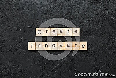 Create innovate word written on wood block. Create innovate text on cement table for your desing, Top view concept Stock Photo