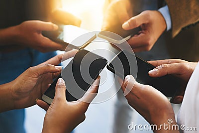 Create meaningful connections. unrecognizable businesspeople using their cellphones. Stock Photo