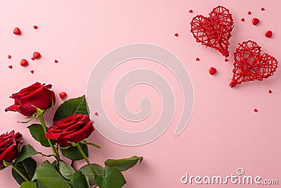 Top view rattan hearts, red roses, sugar sprinkles on pastel pink, a canvas for your text or advertisement Stock Photo