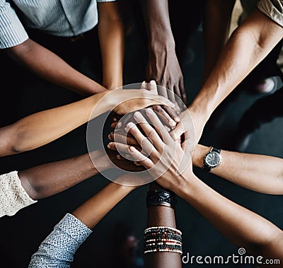 Create a symbolic image of clasped hands, representing unity and solidarity Stock Photo