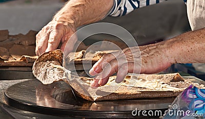 Creating a cheese crepe Stock Photo