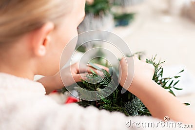 Creating Christmas floral arrangement with carnations, chrysanthemum santini flowers and fir Stock Photo