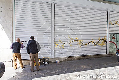 Creating modern art on a shop roll ups Stock Photo