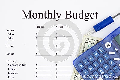 Creating a monthly budget with calculator Stock Photo