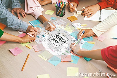 Creative business team brainstorming about marketing plan. Closeup. Variegated. Stock Photo