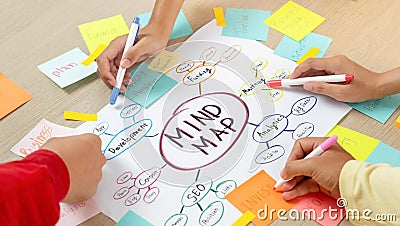 Creative business team brainstorming about marketing plan. Closeup. Variegated. Stock Photo