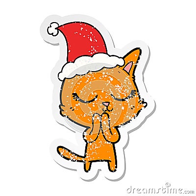 A creative calm distressed sticker cartoon of a cat wearing santa hat Vector Illustration