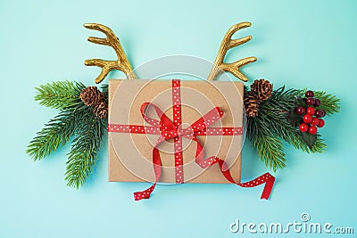 Creative Christmas background with gift box and reindeer horns Stock Photo