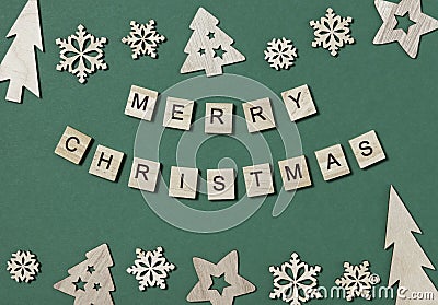 Creative Christmas flat lay composition, inscription Merry Christmas made of wooden blocks with letters and Xmas Stock Photo