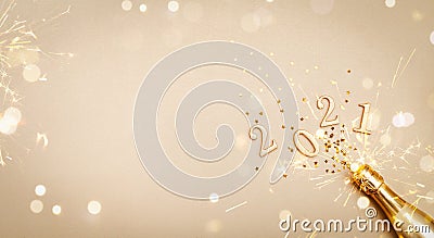 Creative Christmas and New Year greeting card with golden champagne bottle, confetti stars and 2021 numbers. Flat lay. Banner. Stock Photo