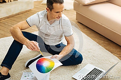Creative clever designer working at home and feeling glad Stock Photo