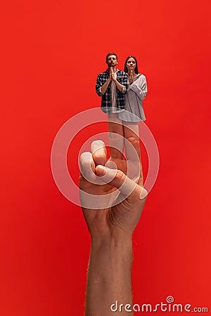 Creative collage with hands. Young man and woman standing with eyes closed, expressing calmness, standing with gesture Stock Photo