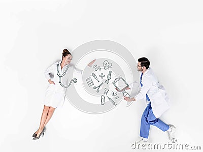 creative collage of male and female doctors with various hand-drawn Stock Photo