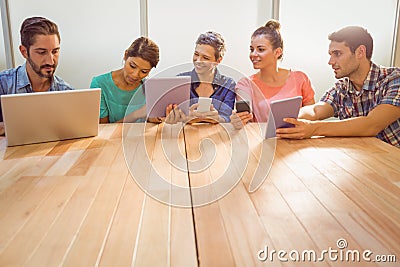 Creative colleagues with laptop and digital tablet Stock Photo
