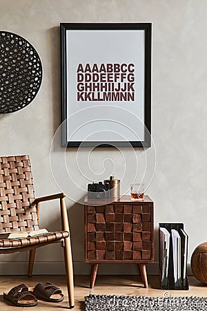 Creative composition of elegant masculine living room design with mock up poster frame, brown armchair, designed commode. Stock Photo