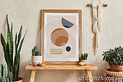 Creative composition of stylish living room interior with mock up poster frame, wooden bench, rattan basket, cacti and boho. Stock Photo