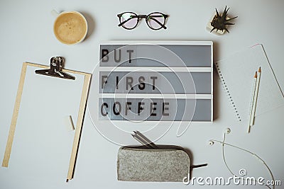 Creative desk But first coffee workspace with clipboard, pen, mu Stock Photo