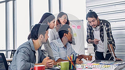 Creative director team lead brainstrom branding project with designer team at meeting table with desktop computer.discussion idea Stock Photo