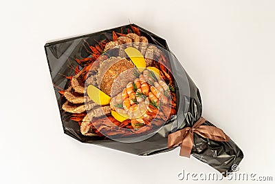 Creative edible Food bouquet on white background. Handmade bouquet for a man of crab, shrimp, crayfish, lemon. Business idea Stock Photo