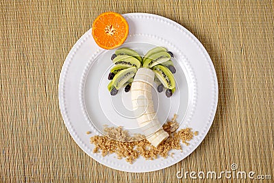 Creative Edible Fruits Palm Tree On A Plate Stock Photo