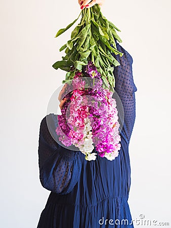 Creative female faceless portrait with bunch of flowers Stock Photo