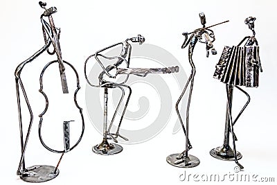 Creative figures of musicians, violoncellist, guitarist, violinist and accordionist are playing together Stock Photo