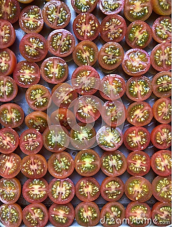 Creative food photography. Tray of tomatoes, cut in half Stock Photo