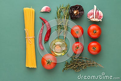 Creative food poster with flat lay knolling of Italian arrabiata pasta ingredients. Spaghetti tomatoes hot chili peppers herbs oil Stock Photo