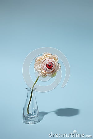 Creative Halloween layout with eyeballs flower in vase Stock Photo
