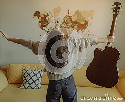 Creative hobby. Talented young female musician sit in armchair alone compose instrumental song using classic guitar. Copy space Stock Photo